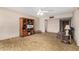 Comfortable living room with vintage carpet, ceiling fan, and classic entertainment center at 6902 E Cypress St, Scottsdale, AZ 85257