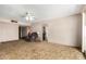 Open-concept living room featuring carpet and a comfortable armchair at 6902 E Cypress St, Scottsdale, AZ 85257