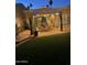 Enclosed patio area beneath large pergola with dining furniture and mood lighting at 7921 E Bonita Dr, Scottsdale, AZ 85250