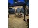 Cozy outdoor seating area under pergola with string lights and decor at 7921 E Bonita Dr, Scottsdale, AZ 85250