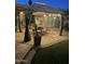 Relaxing patio area under gazebo with string lights and outdoor decor at 7921 E Bonita Dr, Scottsdale, AZ 85250