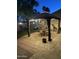 Exterior patio dining under gazebo with landscape and hardscape at 7921 E Bonita Dr, Scottsdale, AZ 85250