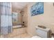 Bright bathroom featuring tub, tile surround, and custom shower curtain at 7921 E Bonita Dr, Scottsdale, AZ 85250