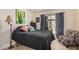 Cozy bedroom with wood flooring, an accent chair and patio access at 7921 E Bonita Dr, Scottsdale, AZ 85250