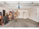 Spacious two car garage filled with storage boxes, shelving, and other household items at 7921 E Bonita Dr, Scottsdale, AZ 85250