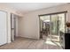 Bright living room with a sliding glass door leading to a patio and a view of the outdoor space at 7921 E Bonita Dr, Scottsdale, AZ 85250