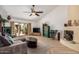 Comfortable living room featuring a fireplace, sliding glass doors to the patio, and stylish decor at 7921 E Bonita Dr, Scottsdale, AZ 85250
