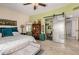 Bright main bedroom featuring eclectic decor, tile flooring and ensuite bathroom at 7921 E Bonita Dr, Scottsdale, AZ 85250