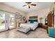 Bright main bedroom featuring eclectic decor, tile flooring and patio access at 7921 E Bonita Dr, Scottsdale, AZ 85250