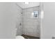 Tiled shower room with grey tiling and a window at 845 W Shannon St, Chandler, AZ 85225