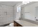 Updated bathroom with granite counter, tiled shower, and modern fixtures at 845 W Shannon St, Chandler, AZ 85225