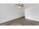 Open bedroom with neutral carpet, ceiling fan, and closet access at 845 W Shannon St, Chandler, AZ 85225