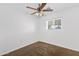 Cozy bedroom with neutral carpet, ceiling fan, and a window providing natural light at 845 W Shannon St, Chandler, AZ 85225