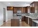 Updated kitchen showcasing custom cabinetry, granite countertops, and modern stainless steel appliances at 845 W Shannon St, Chandler, AZ 85225