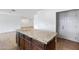 Kitchen island featuring granite countertop and dark wood cabinets at 845 W Shannon St, Chandler, AZ 85225