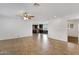 Open-concept living area with tile flooring, a ceiling fan, and views into the updated kitchen at 845 W Shannon St, Chandler, AZ 85225
