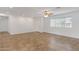 Inviting living room featuring tile floors, a ceiling fan, and a bright window overlooking the neighborhood at 845 W Shannon St, Chandler, AZ 85225
