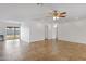 Expansive living space features tile flooring, ceiling fan, and sliding glass door leading to outdoor space at 845 W Shannon St, Chandler, AZ 85225