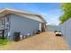 Spacious side yard with gravel, storage, and access to the home at 845 W Shannon St, Chandler, AZ 85225