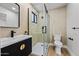 Modern bathroom with glass shower, floating vanity, and stylish fixtures at 8544 E Heatherbrae Dr, Scottsdale, AZ 85251