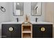 Close-up of dual vanity with modern sinks and decorative accents in a contemporary bathroom at 8544 E Heatherbrae Dr, Scottsdale, AZ 85251