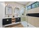 Stylish bathroom featuring dual vanities, modern fixtures, and walk-in shower at 8544 E Heatherbrae Dr, Scottsdale, AZ 85251