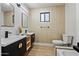 Modern bathroom featuring double sink vanity, sleek fixtures, and decorative accents at 8544 E Heatherbrae Dr, Scottsdale, AZ 85251