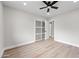 Bright bedroom featuring sliding-door closet and modern ceiling fan at 8544 E Heatherbrae Dr, Scottsdale, AZ 85251