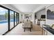 Sunlit dining room leads to a backyard oasis with a sparkling pool at 8544 E Heatherbrae Dr, Scottsdale, AZ 85251