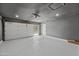 Spacious garage with a large overhead door and ample storage space at 8544 E Heatherbrae Dr, Scottsdale, AZ 85251