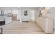 Modern open-concept kitchen with white cabinetry and stainless steel appliances at 8544 E Heatherbrae Dr, Scottsdale, AZ 85251