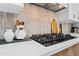 Close up of the kitchen's stove top and decorative items, enhancing the space at 8544 E Heatherbrae Dr, Scottsdale, AZ 85251