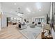Bright living room featuring skylights, modern furnishings, and an open-concept design at 8544 E Heatherbrae Dr, Scottsdale, AZ 85251
