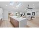 Open-concept living space blending kitchen, living, and dining areas under bright skylights at 8544 E Heatherbrae Dr, Scottsdale, AZ 85251