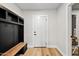 Mud room entrance area with bench and coat hooks for easy storage at 8544 E Heatherbrae Dr, Scottsdale, AZ 85251