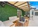Cozy outdoor patio with comfortable seating, stylish decor, and a shaded pergola at 8544 E Heatherbrae Dr, Scottsdale, AZ 85251