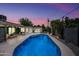 Inviting backyard with a sparkling pool, poolside lounge area, and well-manicured landscaping at 8544 E Heatherbrae Dr, Scottsdale, AZ 85251