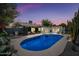 Backyard with a private pool surrounded by seating, mature trees, and lush desert landscaping at 8544 E Heatherbrae Dr, Scottsdale, AZ 85251