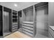 Organized walk-in closet with custom shelving, drawers, and ample storage space at 8544 E Heatherbrae Dr, Scottsdale, AZ 85251