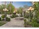 Beautiful backyard features a stone fountain, manicured landscaping, and elegant outdoor lighting at 8815 N 65Th St, Paradise Valley, AZ 85253