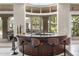 Indoor bar area featuring a curved countertop, stylish seating, and outdoor views at 8815 N 65Th St, Paradise Valley, AZ 85253
