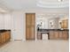 Spacious bathroom with custom cabinetry, large mirrors, tile flooring, and seamless arched doorways at 8815 N 65Th St, Paradise Valley, AZ 85253