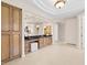 Elegant bathroom featuring custom cabinetry, a marble countertop, and seamless arched doorways at 8815 N 65Th St, Paradise Valley, AZ 85253