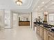 Luxurious bathroom with marble countertops, tiled floors, and a walk-in glass block shower at 8815 N 65Th St, Paradise Valley, AZ 85253