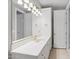Well-lit bathroom features a vanity, decorative light fixture and white tile countertop at 8815 N 65Th St, Paradise Valley, AZ 85253