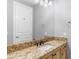 Bathroom featuring vanity with gold hardware and framed mirror at 8815 N 65Th St, Paradise Valley, AZ 85253