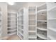 Well-organized walk-in closet featuring white shelving and rotating storage at 8815 N 65Th St, Paradise Valley, AZ 85253