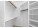 Walk-in closet features a combination of shelves, hanging rods, and white finishings at 8815 N 65Th St, Paradise Valley, AZ 85253