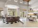 Dining room with a view of the bar and backyard, and a modern chandelier at 8815 N 65Th St, Paradise Valley, AZ 85253