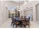 Elegant dining room with a large round table, chandelier, and natural light at 8815 N 65Th St, Paradise Valley, AZ 85253